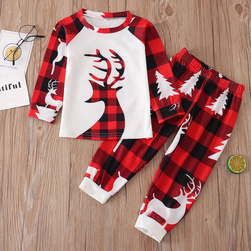 Cosy red plaid pyjama set featuring reindeer for kids