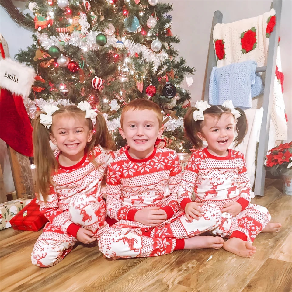 Red and white reindeer print pyjama set for families